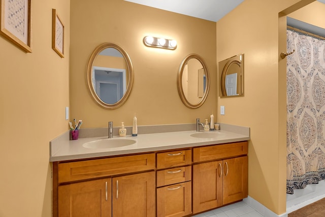 bathroom featuring vanity and a shower with curtain