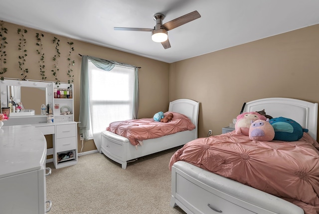 bedroom with light colored carpet and ceiling fan