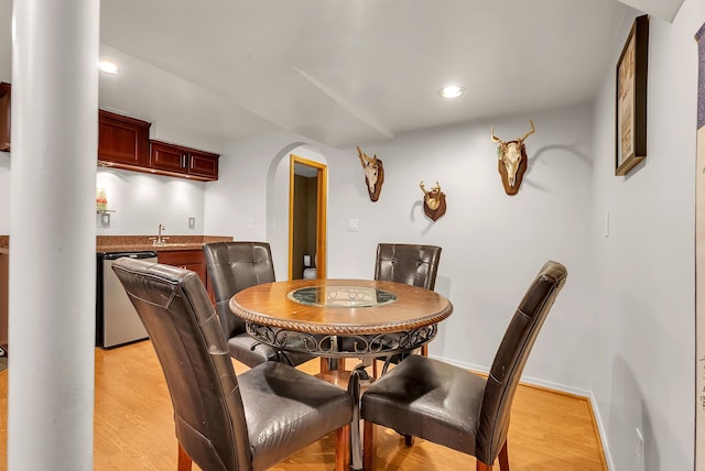 dining space with light wood-type flooring