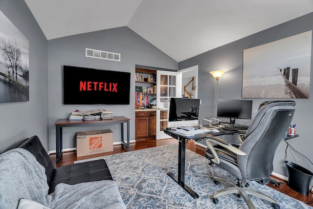 office featuring vaulted ceiling and dark hardwood / wood-style floors