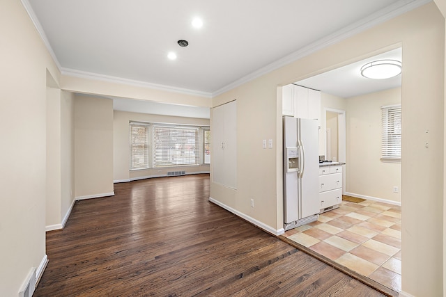 corridor with crown molding and light hardwood / wood-style flooring