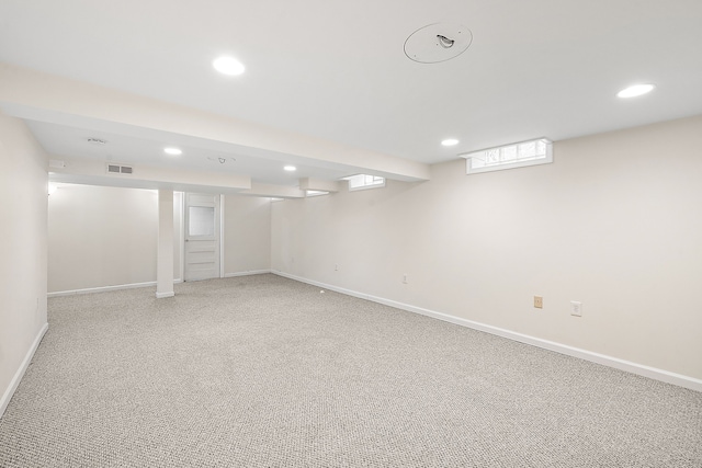 basement with light colored carpet