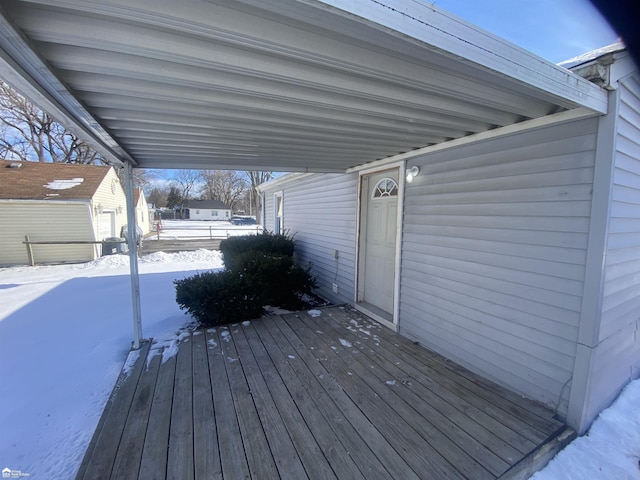 view of snow covered deck