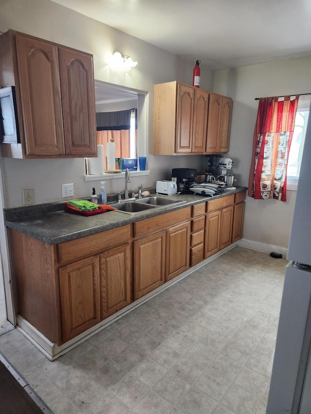 kitchen with white refrigerator and sink