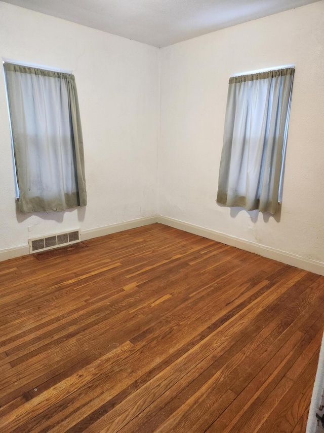 unfurnished room featuring wood-type flooring