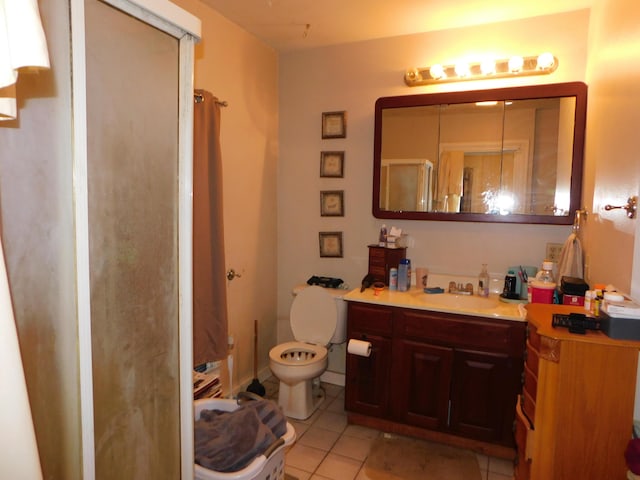 bathroom featuring walk in shower, tile patterned floors, toilet, and vanity