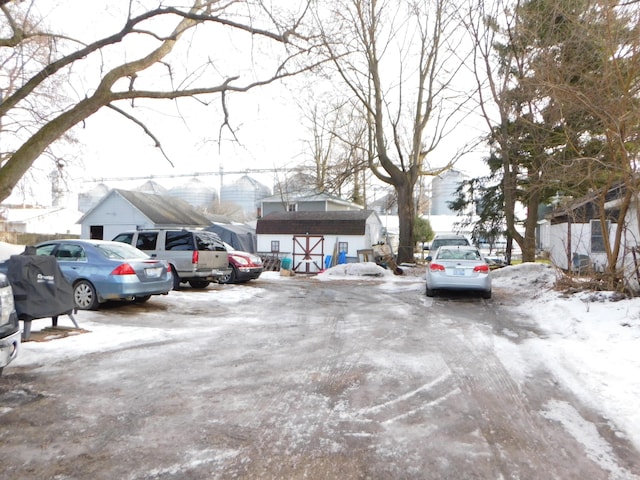 view of snow covered parking