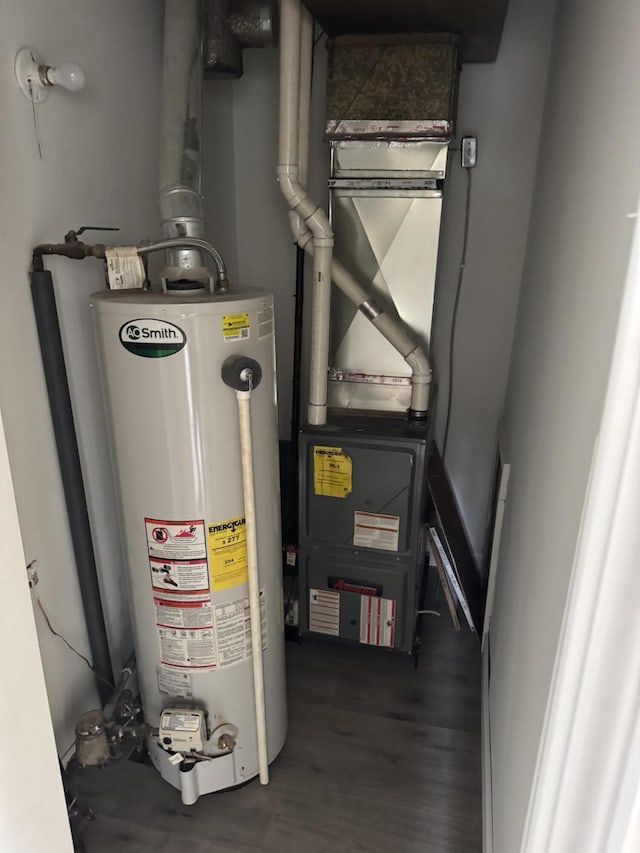 utility room featuring gas water heater