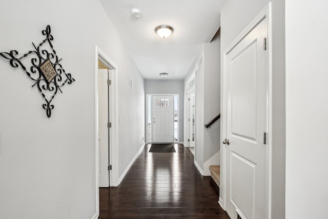 hall with dark wood-type flooring