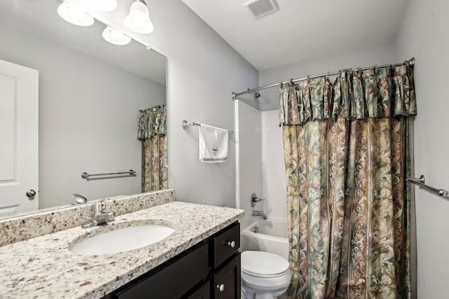 full bathroom with vanity, toilet, and shower / bath combo with shower curtain