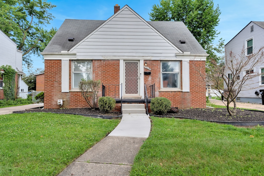 bungalow with a front lawn