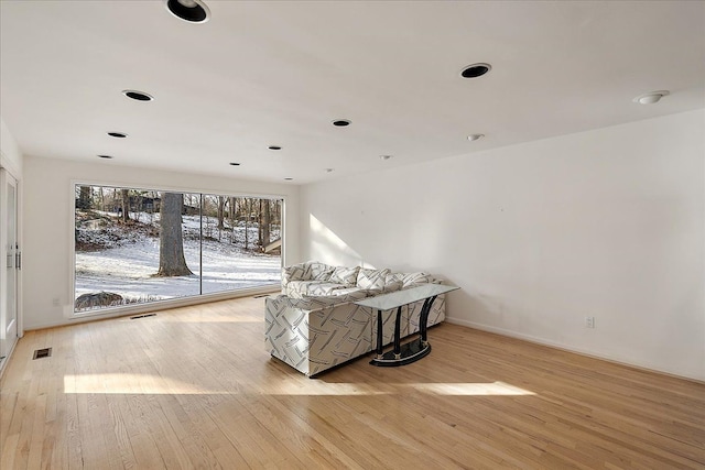 living area with light hardwood / wood-style flooring