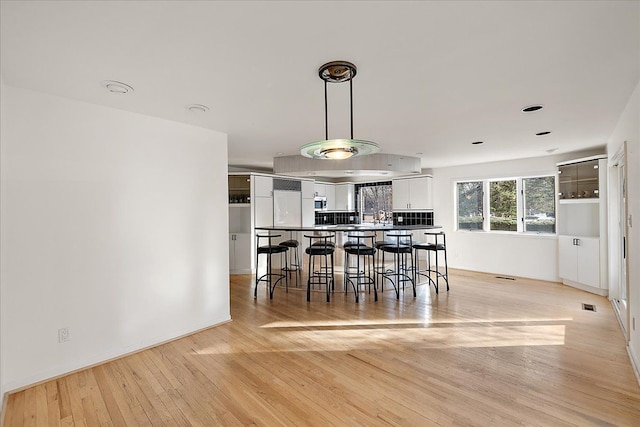 unfurnished dining area with light hardwood / wood-style flooring