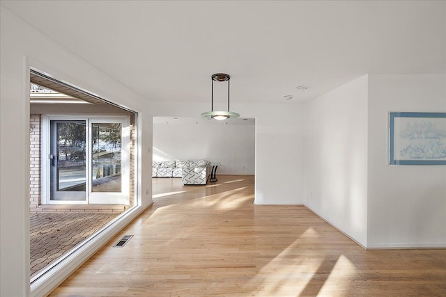 hallway featuring light hardwood / wood-style flooring