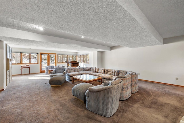 living room featuring carpet floors and a textured ceiling