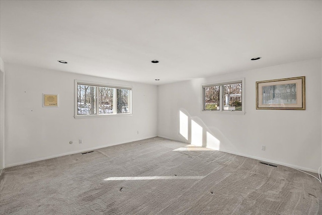 empty room with light colored carpet