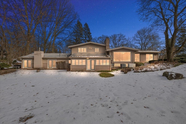 view of snow covered house