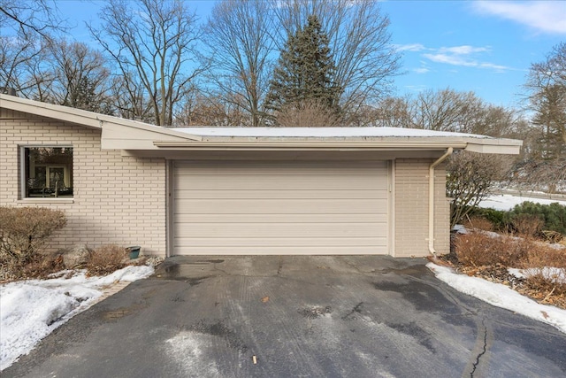 view of snow covered garage