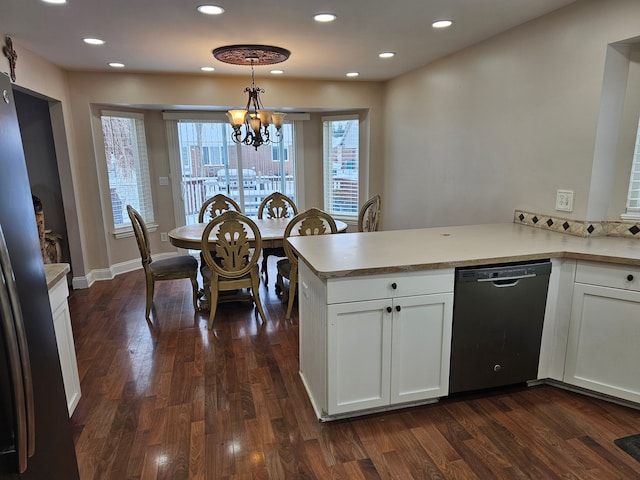 kitchen featuring dishwasher, pendant lighting, white cabinets, and kitchen peninsula