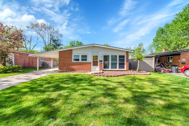 ranch-style house featuring a carport and a front yard