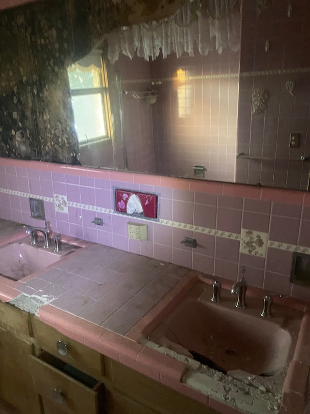 interior space featuring tasteful backsplash and sink