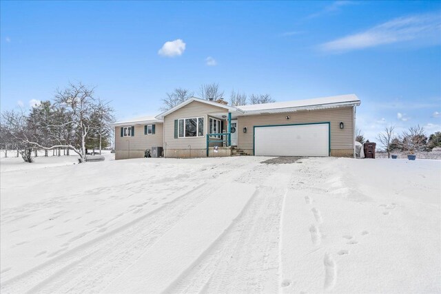 ranch-style house featuring a garage