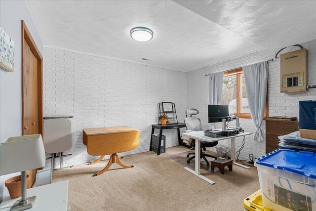 home office featuring brick wall and light carpet