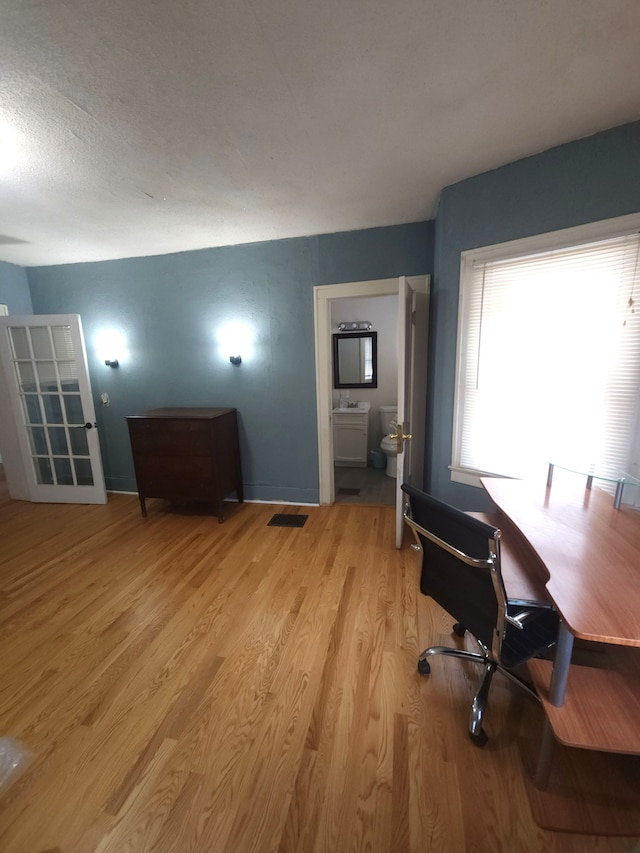 unfurnished office featuring light hardwood / wood-style floors