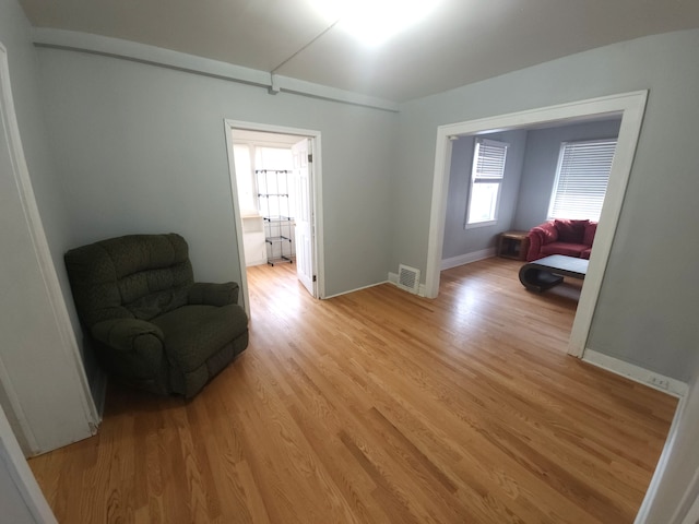 living area with light hardwood / wood-style flooring