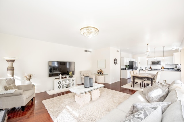 living room with dark hardwood / wood-style flooring