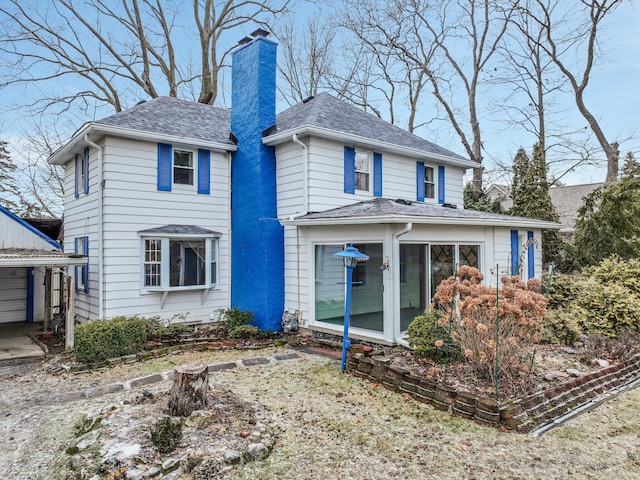 view of front of home with a sunroom