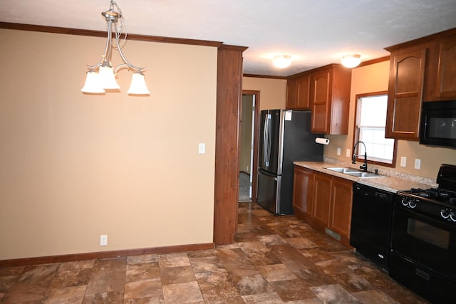 kitchen featuring sink, crown molding, an inviting chandelier, pendant lighting, and black appliances