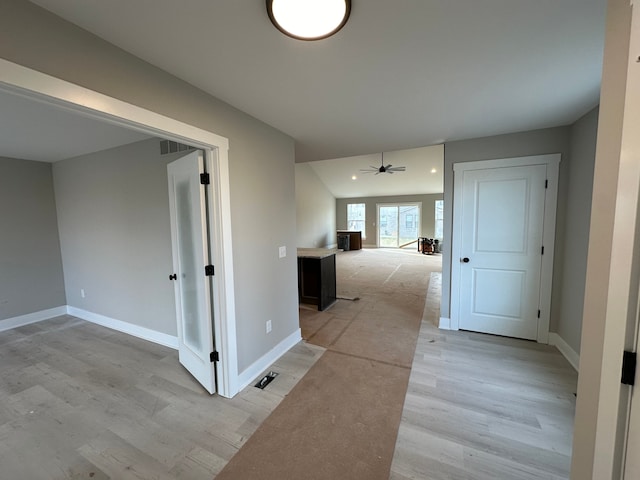 hallway featuring light wood-type flooring