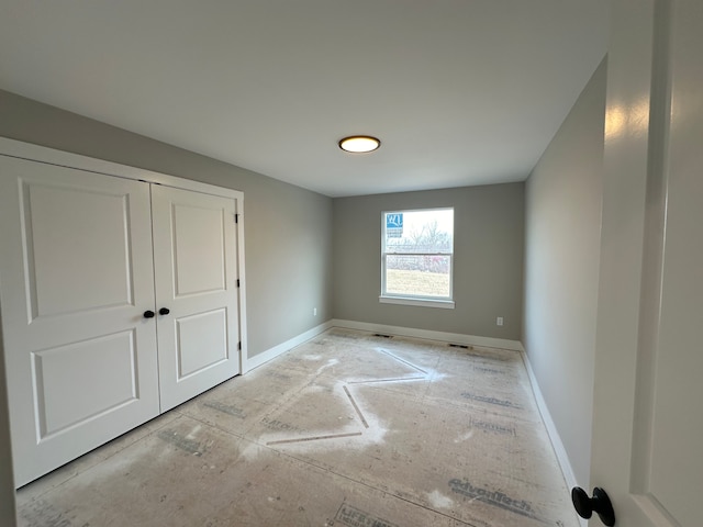 unfurnished bedroom featuring a closet