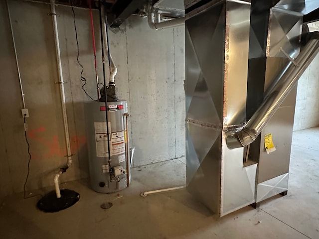 utility room featuring heating unit and gas water heater