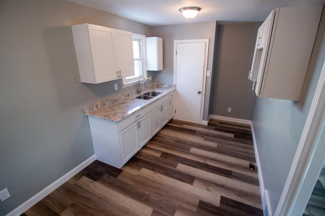 kitchen featuring sink, white cabinets, and dark hardwood / wood-style floors