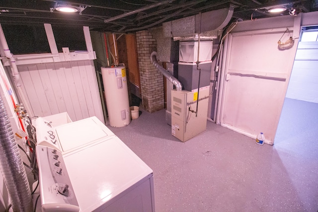 basement with washer / dryer, electric water heater, and heating unit