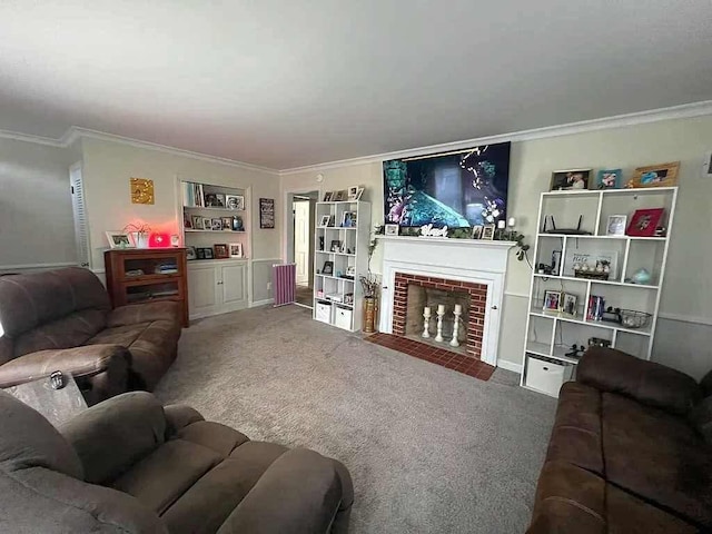 living room with built in shelves, ornamental molding, carpet flooring, and a brick fireplace