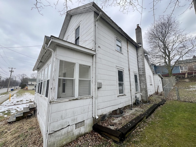 view of side of property with a sunroom