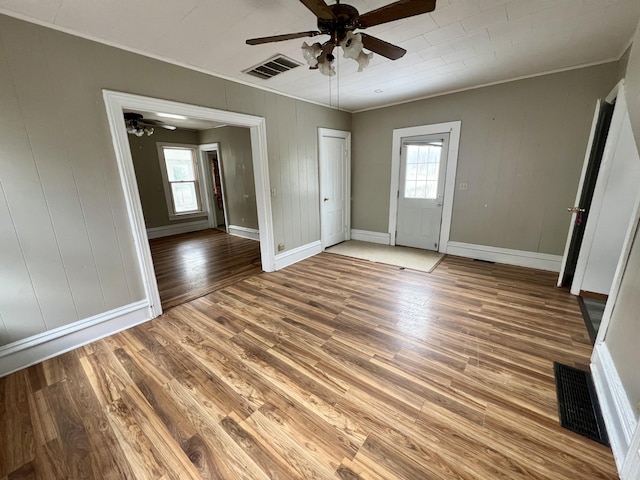 interior space featuring hardwood / wood-style flooring, crown molding, and ceiling fan