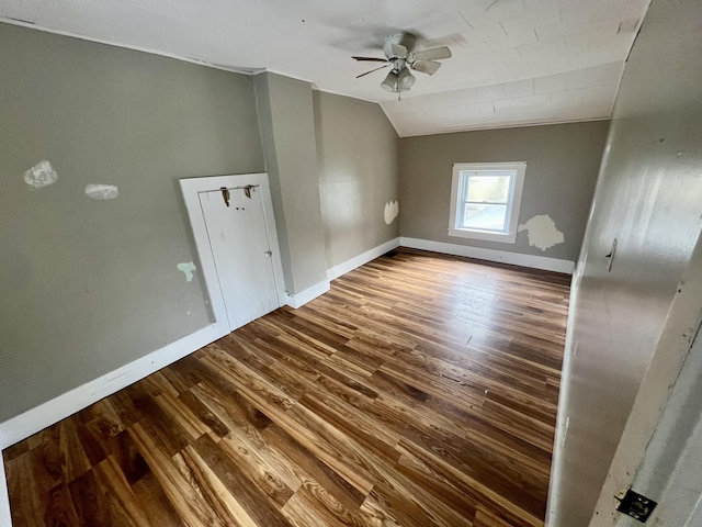 interior space featuring wood-type flooring, lofted ceiling, and ceiling fan