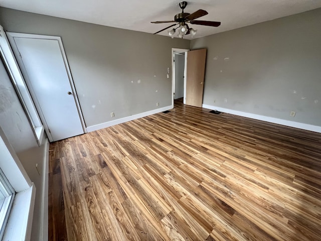 unfurnished bedroom with hardwood / wood-style floors and ceiling fan