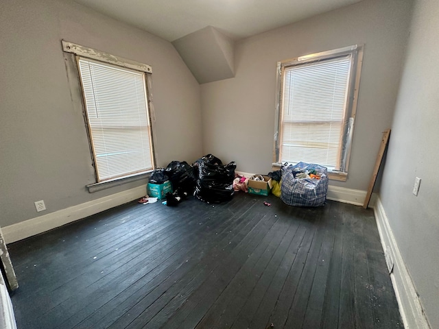 additional living space with dark hardwood / wood-style floors