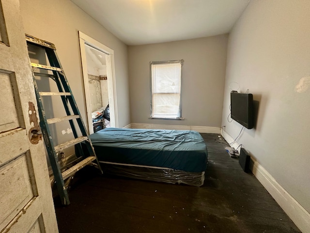 bedroom featuring dark hardwood / wood-style floors