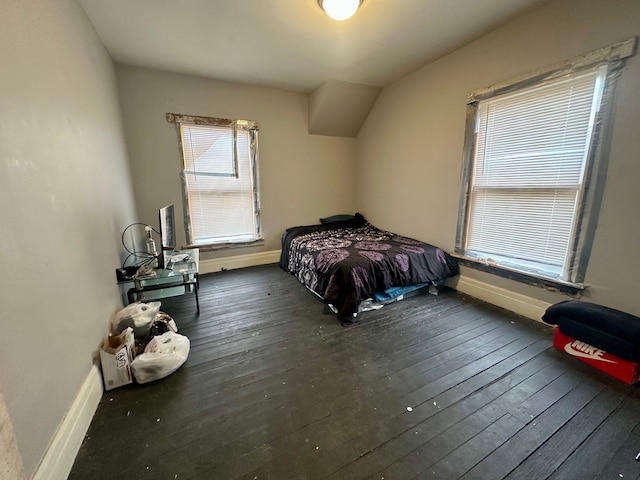 bedroom featuring dark hardwood / wood-style flooring