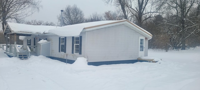 view of snow covered property