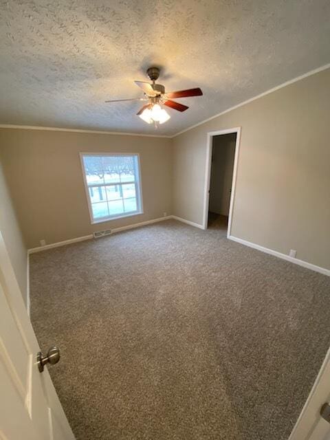 unfurnished room featuring ornamental molding, carpet flooring, and a textured ceiling