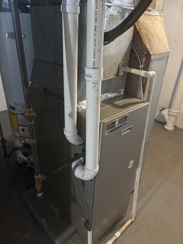 utility room featuring heating unit