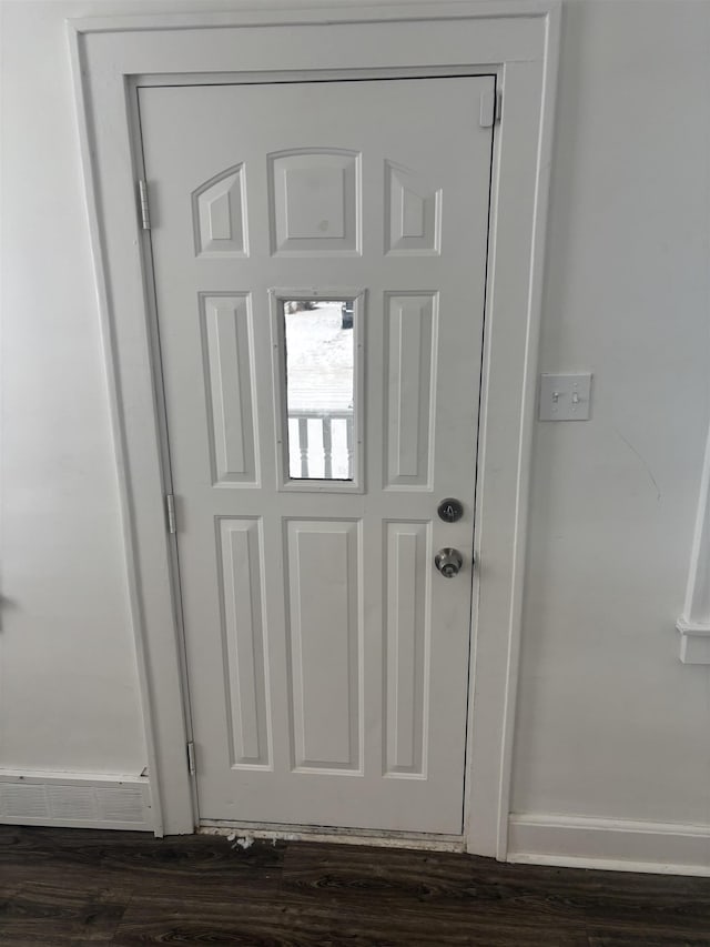 details featuring visible vents, baseboards, and wood finished floors