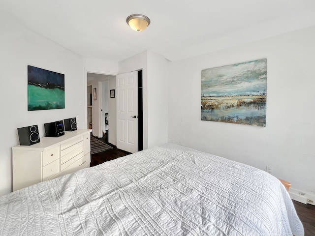 bedroom featuring dark hardwood / wood-style flooring